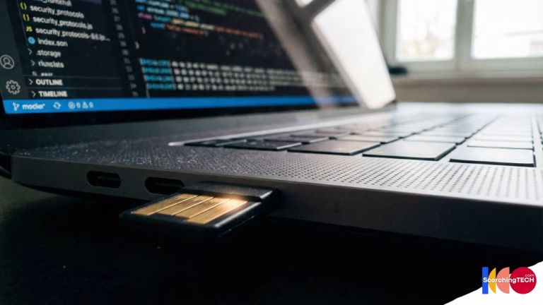 Macro photography of a YubiKey 5C plugged into a laptop USB-C port ready for authentication.